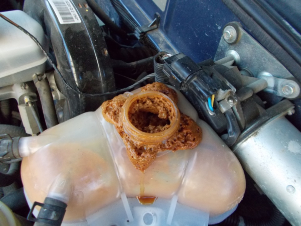 Mazda3: Как заменить охлаждающую жидкость